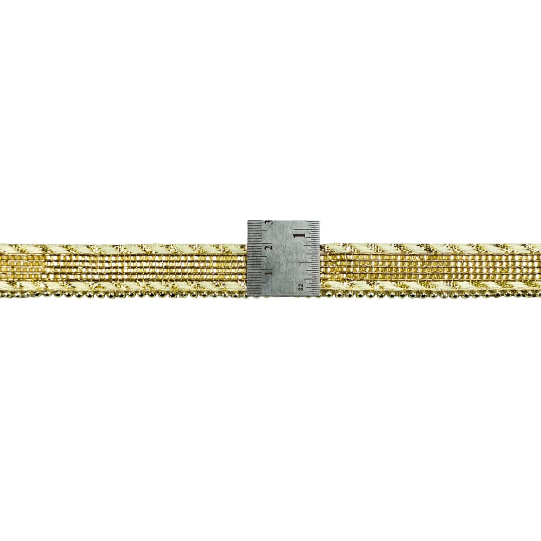 Gold ribbon with a ruler for measurement on a white background